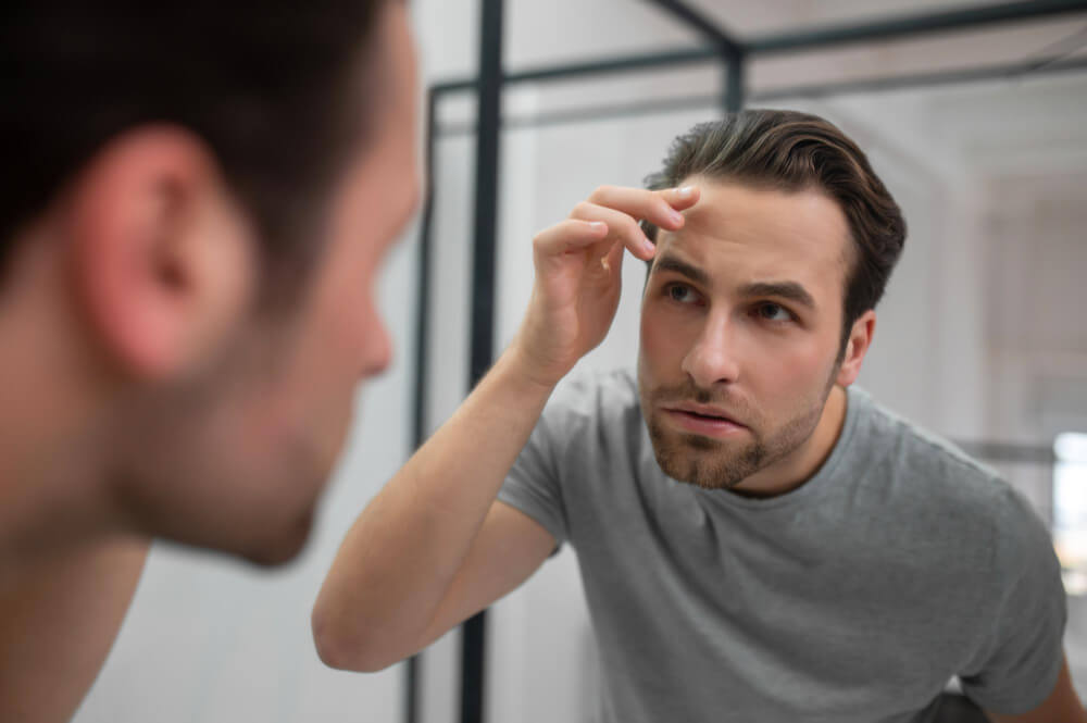 Common Types of Hair Loss in Men: Causes &amp; Symptoms